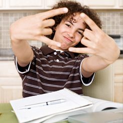 A young person having fun learning German. 